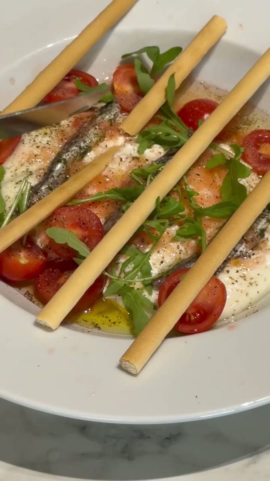 Burrata with Anchovies, Tomatoes, and Arugula